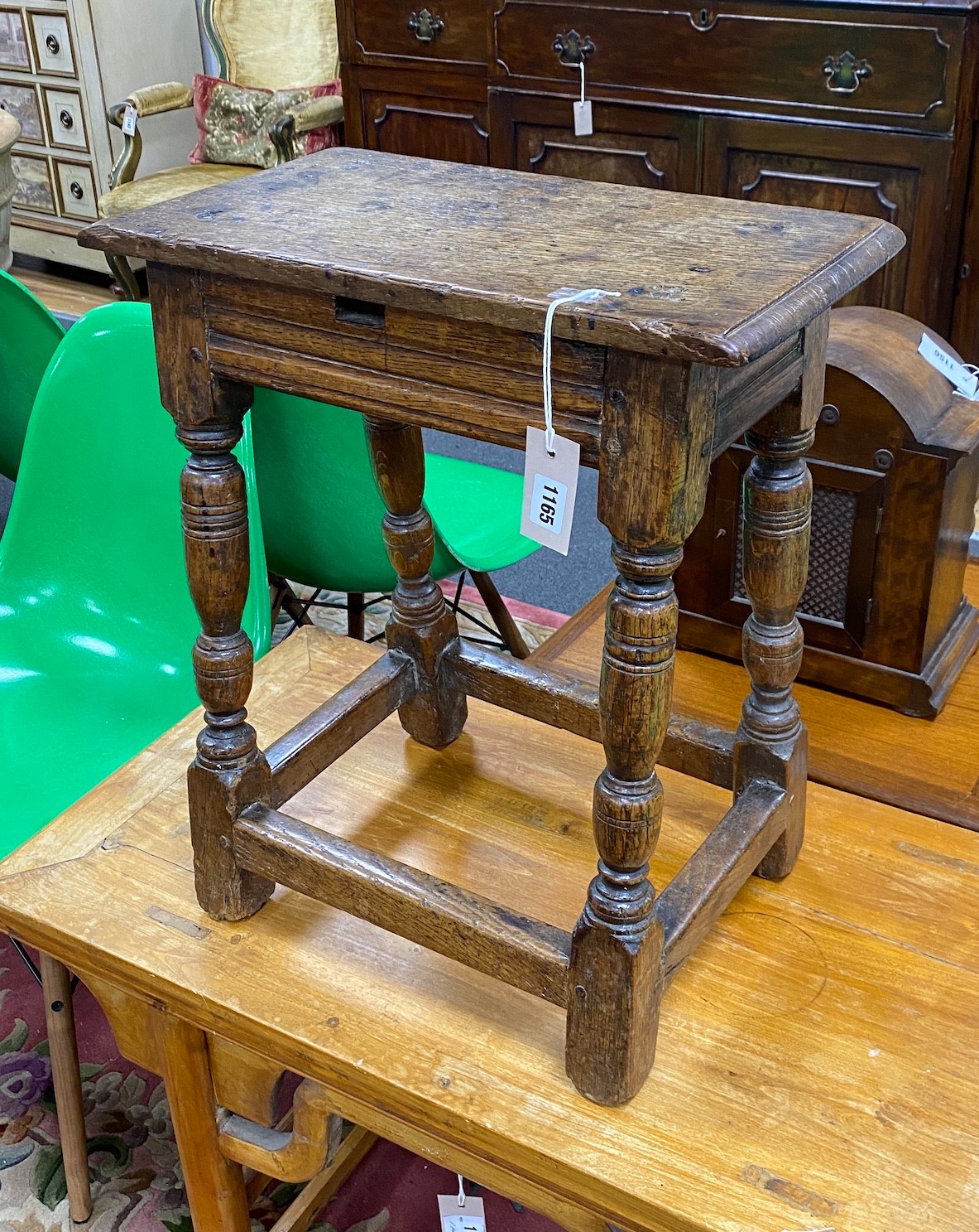 A 17th century style oak joint stool, modified, height 54cm